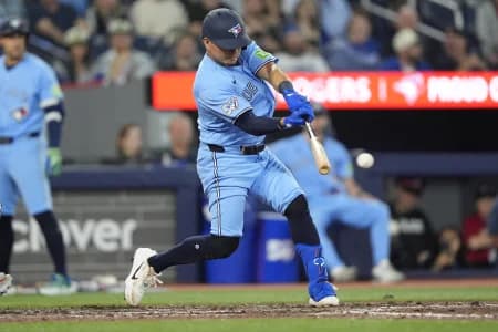 Toronto Blue Jays second baseman Luis Urias (48) hits a single against the Houston Astros during the eighth inning at Rogers Centre.