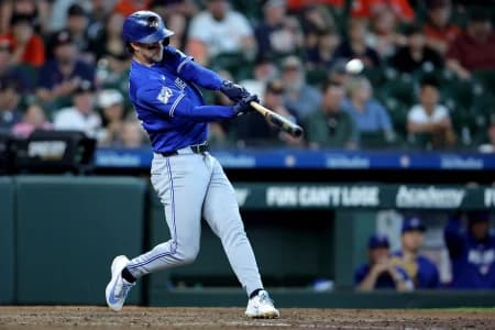 Toronto Blue Jays third baseman Ernie Clement (22) hits a two-run home run to left field against the Houston Astros during the 10th inning at Daikin Park.