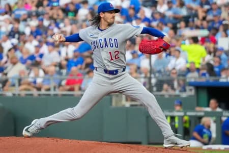 Chicago Cubs starting pitcher Kevin Gausman (12) delivers a pitch against the Kansas City Royals during the first inning at Kauffman Stadium.