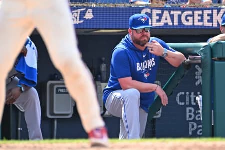 Toronto Blue Jays manager John Schneider (14) looks on from the dugout against the Philadelphia Phillies during the sixth inning at Citizens Bank Park.