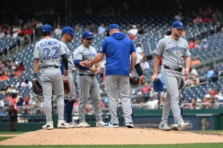 Toronto Blue Jays manager John Schneider (14) removes pitcher Trey Yesavage (39) from the game against the Washington Nationals during the seventh inning at Nationals Park.