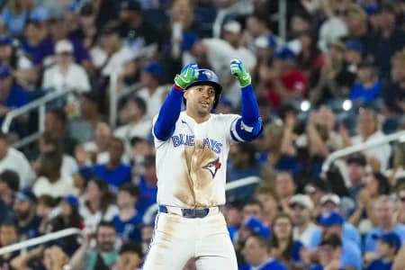 Toronto Blue Jays designated hitter George Springer (4) celebrates hitting a single against the Boston Red Sox during the eighth inning at Rogers Centre