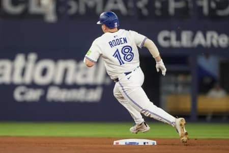 Toronto Blue Jays outfielder Alan Roden (18) rounds second base on his way to a triple against the Chicago White Sox during the seventh inning in their MLB game at Rogers Centre.