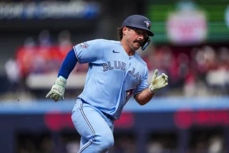 Toronto Blue Jays left fielder Davis Schneider (36) runs to third base during the third inning against the St. Louis Cardinals at Rogers Centre.