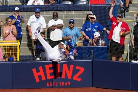 Toronto Blue Jays first baseman Vladimir Guerrero Jr. (27) crashes into the field netting during the sixth inning against the Boston Red Sox at Rogers Centre