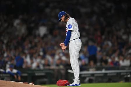 Chicago Cubs pitcher Kevin Gausman (12) reacts in an injury delay against the Chicago White Sox during the fourth inning at Wrigley Field.