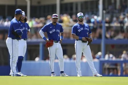 Toronto Blue Jays third baseman Isiah Kiner-Falefa (7) shortstop Bo Bichette (11) second baseman Santiago Espinal (5) and first baseman Spencer Horwitz (48) wait for a pitching change against the New York Yankees in the first inning at TD Ballpark.
