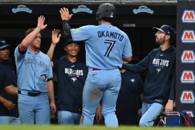 Toronto Blue Jays third baseman Kazuma Okamoto (7) celebrates after scoring during the fifth inning against the Cleveland Guardians at Progressive Field