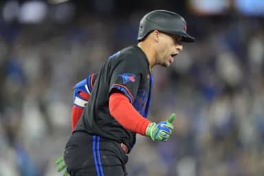 Toronto Blue Jays designated hitter George Springer (4) reacts as he runs the bases on his solo home run against the Seattle Mariners during the fifth inning at Rogers Centre