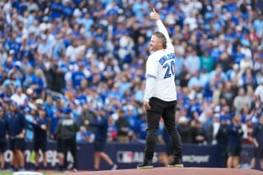 Former Toronto Blue Jays Josh Donaldson throws the first pitch before the game between the Toronto Blue Jays and Seattle Mariners during game two of the ALCS round for the 2025 MLB playoffs at Rogers Centre