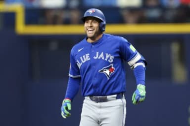 Toronto Blue Jays designated hitter George Springer (4) reacts after hitting a two rbi single against the Tampa Bay Rays in the seventh inning at Tropicana Field.