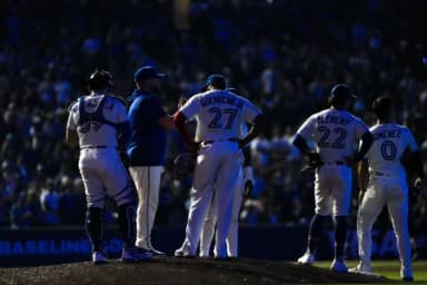 Toronto Blue Jays manager John Schneider (14) stands on the mound beside first baseman Vladimir Guerrero Jr. (27) during the ninth inning against the Boston Red Sox at Rogers Centre