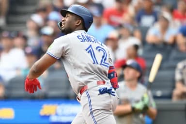 Toronto Blue Jays left fielder Jesus Sanchez (12) hits an RBI single during the fifth inning against the Cleveland Guardians at Progressive Field.
