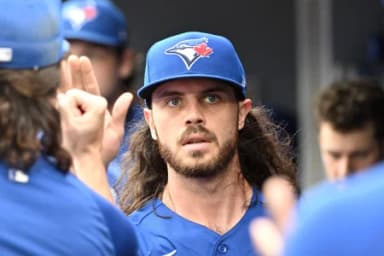 Toronto Blue Jays relief pitcher Spencer Arrighetti (45) is greeted by team mates in the dugout after being relieved against the Baltimore Orioles in the sixth inning at Rogers Centre