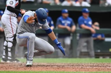 Toronto Blue Jays left fielder Lourdes Gurriel Jr. (13) slides to score during the ninth inning against the Baltimore Orioles at Oriole Park at Camden Yards. M