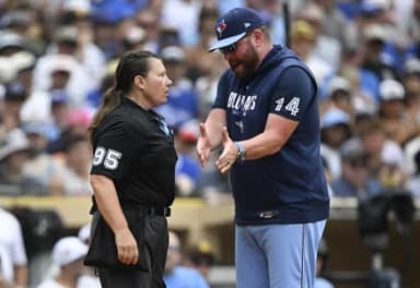 Toronto Blue Jays manager John Schneider (14) argues with home plate umpire Jen Pawol (95) during the second inning against the San Diego Padres at Petco Park.