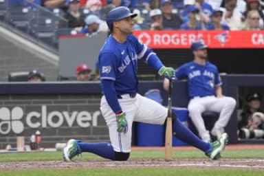 Toronto Blue Jays designated hitter George Springer (4) kneels after taking a strike against the Baltimore Orioles during the eighth inning at Rogers Centre.