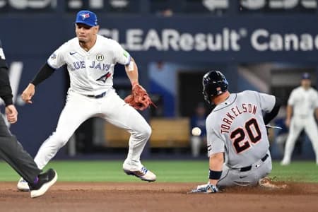 Detroit Tigers first baseman Spencer Torkleson (20) steals second base as Toronto Blue Jays shortstop Andres Gimenez (0) misses the ball in the sixth inning at Rogers Centre.