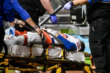 New York Mets first baseman Jared Young (29) receives medical attention after an injury at first base during the sixth inning against the Philadelphia Phillies at Citi Field.