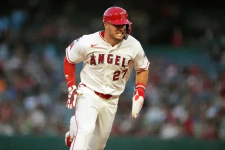 Los Angeles Angels designated hitter Mike Trout (27) rounds third base to score in the first inning against the Minnesota Twins at Angel Stadium.