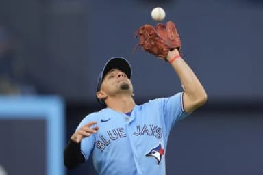 Toronto Blue Jays shortstop Andres Gimenez (0) catches a fly ball hit by Kansas City Royals shortstop Bobby Witt (not pictured)during the first inning at Rogers Centre.