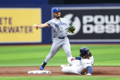 Toronto Blue Jays second baseman Lenyn Sosa (50) turns a double play against the Tampa Bay Rays in the first inning at Tropicana Field.
