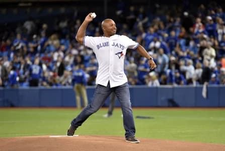 Toronto Blue Jays former player Vernon Wells throws out the ceremonial first pitch before the game against the Kansas City Royals in game five of the ALCS at Rogers Centre.