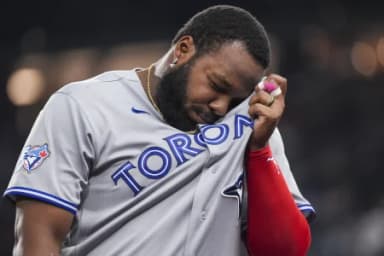 Toronto Blue Jays first baseman Vladimir Guerrero Jr. (27) walks to the dugout after the end of the fifth inning against the Texas Rangers at Globe Life Field.