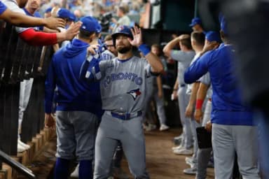 Toronto Blue Jays right fielder Nathan Lukes (38) is congratulated by teammates in the dugout after scoring a run during the seventh inning against the Texas Rangers at Globe Life Field.