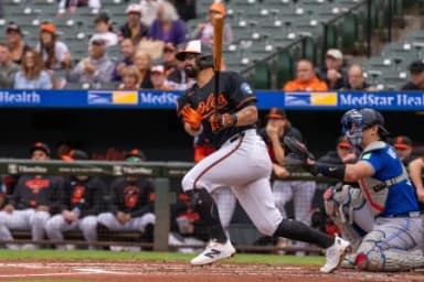 Baltimore Orioles first baseman Christian Encarnacion-Strand (32) singles to left during the second inning at Oriole Park at Camden Yards.