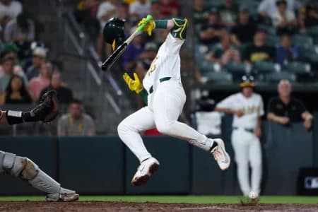 Athletics catcher Brian Serven (10) gets hit by pitch during the sixth inning against the Los Angeles Angels at Sutter Health Park.