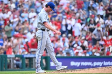Toronto Blue Jays pitcher Shane Bieber (57) reacts after Philadelphia Phillies designated hitter Kyle Schwarber (12) (not pictured) hit a home run during the fifth inning against the Toronto Blue Jays at Citizens Bank Park.
