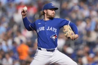 Toronto Blue Jays starting pitcher Spencer Miles (62) pitches to the Cincinnati Reds during the third inning at Rogers Centre.