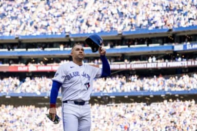 Toronto Blue Jays designated hitter George Springer (4) waves to the fans after being replaced in the during the third inning against the Cincinnati Reds at Rogers Centre.