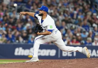 Toronto Blue Jays relief pitcher Yimi García (93) throws a pitch against the Cleveland Guardians during the ninth inning at Rogers Centre.