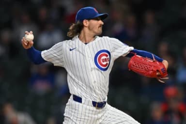 Chicago Cubs pitcher Kevin Gausman (12) pitches against the Miami Marlins during the first inning at Wrigley Field.