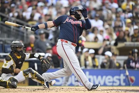 Atlanta Braves designated hitter Rowdy Tellez (11) hits an RBI single during the second inning against the San Diego Padres at Petco Park.