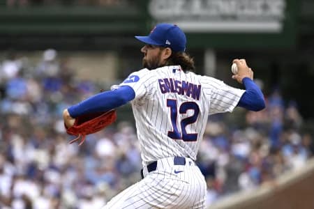 Chicago Cubs pitcher Kevin Gausman (12) delivers the ball during the first inning against the Cincinnati Reds at Wrigley Field.