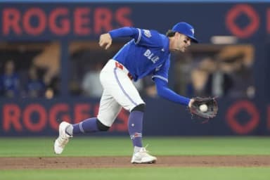Toronto Blue Jays second baseman Ernie Clement (22) catches a ground ball hit by Detroit Tigers center fielder Max Clark (not pictured)during the second inning at Rogers Centre.