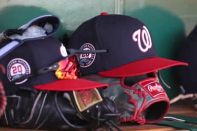 Washington Nationals hats and gloves in the dugout against the Pittsburgh Pirates during the sixth inning at PNC Park.