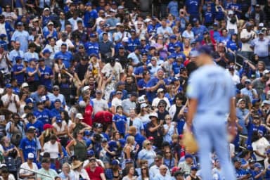 Toronto Blue Jays fans cheer on as Toronto Blue Jays pitcher Tyler Rogers (71) pitches against the St. Louis Cardinals during the ninth inning at Rogers Centre