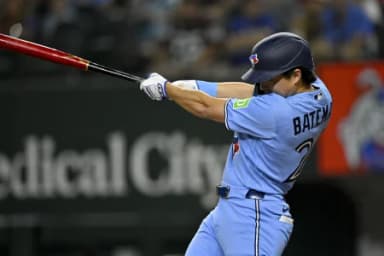 Toronto Blue Jays center fielder Brett Bateman (21) hits a single during the sixth inning against the Texas Rangers at Globe Life Field.
