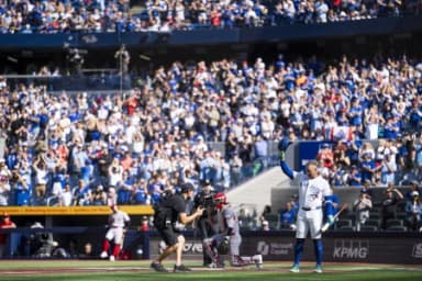 Toronto Blue Jays George Springer (4) waves to the fans before taking an at-bat against the Cincinnati Reds during the first inning at Rogers Centre.