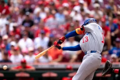 Chicago Cubs designated hitter Kevin Alcantara (13) hits an 2-run RBI base hit in the fourth inning between the Chicago Cubs and Cincinnati Reds at Great American Ball Park in Cincinnati on Sunday, July 12, 2026.