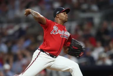 Atlanta Braves pitcher Raisel Iglesias (26) pitches against the Los Angeles Dodgers during the ninth inning at Truist Park.