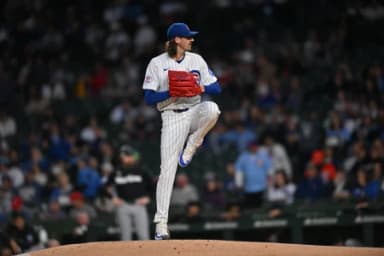 Chicago Cubs pitcher Kevin Gausman (12) pitches against the Miami Marlins during the first inning at Wrigley Field.