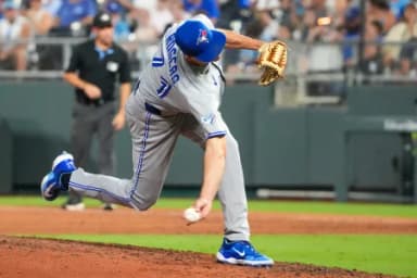 Toronto Blue Jays pitcher Tyler Rogers (71) delivers a pitch against the Kansas City Royals during the eighth inning at Kauffman Stadium.