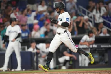 Miami Marlins second baseman Otto Lopez (6) scores a run against the Atlanta Braves in the seventh inning at loanDepot Park