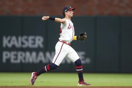Atlanta Braves outfielder Mauricio Dubon (14) throws to first for an out against the Los Angeles Dodgers during the eighth inning in game four of the NLDS for the 2026 MLB Playoffs at Truist Park.