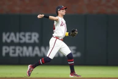 Atlanta Braves outfielder Mauricio Dubon (14) throws to first for an out against the Los Angeles Dodgers during the eighth inning in game four of the NLDS for the 2026 MLB Playoffs at Truist Park.